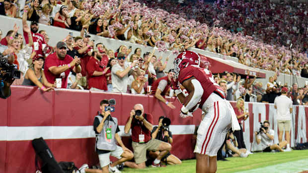Alabama Crimson Tide running back Jase McClellan (2) celebrates with fans after scoring a touchdown against the Utah State Aggies at Bryant-Denny Stadium. Alabama won 55-0.